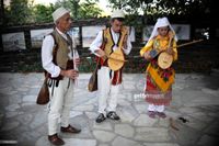 Kosovo Albanians dressed in traditional costumes